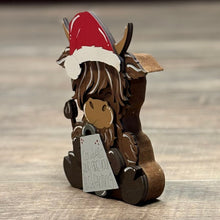 Load image into Gallery viewer, Chunky Highland Cow Shelf Sitter with Santa Hat | Hand-Painted Christmas Décor
